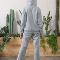 Women's long-sleeved hoodie set by MANDOTOS, featuring a comfortable matching top and pants in a casual style.