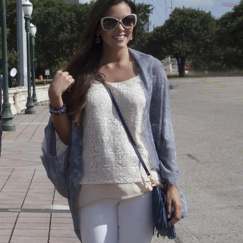 Mandotos Denim Blossom Poncho featuring a floral pattern and casual fit, displayed on a neutral background.