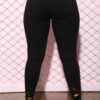 Mandotos denim pencil pants for women with slim fit, ripped holes, stretch fabric, long length, and tapered feet.