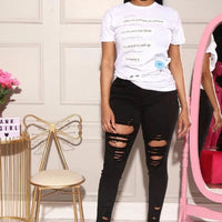 Mandotos denim pencil pants for women featuring slim fit, ripped holes, stretch fabric, long length, and tapered feet.