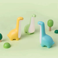 Mandotos Dino Dream Light glowing with friendly dinosaur shape, soft LED illumination for cozy bedroom decor or nightlight.