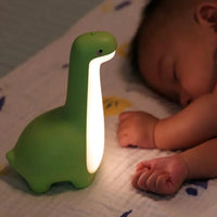 Mandotos Dino Dream Light, a cute dinosaur-shaped night light with soft glow for kids' bedrooms.