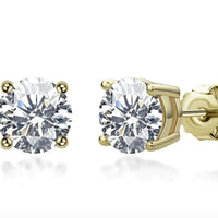 Elegant 18K gold and silver moissanite stud earrings by MANDOTOS, showcasing sparkling gemstone details.