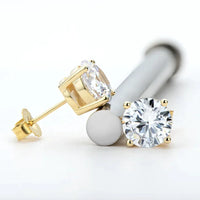 Elegant 18K gold and silver moissanite stud earrings with a sparkling, sophisticated design.