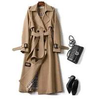 Mandotos Elegant Classic Trench coat displayed on a hanger, showcasing its timeless design and neutral color.