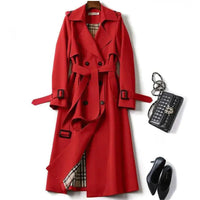Mandotos elegant classic trench coat with a tailored fit, featuring a double-breasted design and stylish lapels.