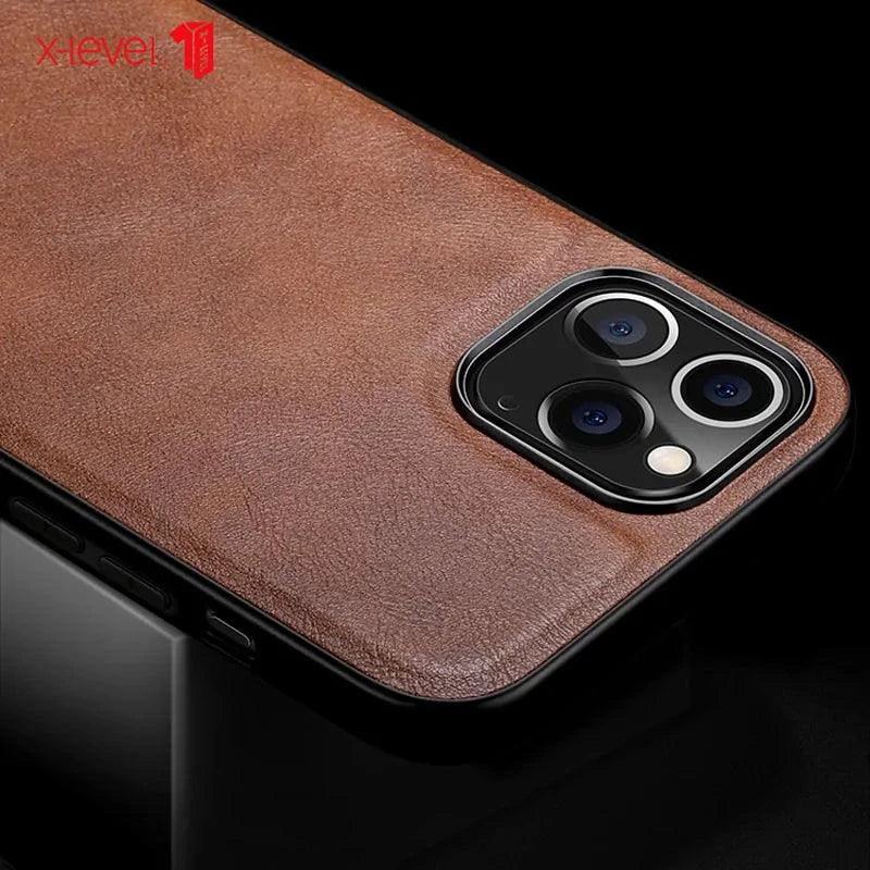 Elegant leather iPhone shield by MANDOTOS with smooth brown finish and precise cutouts for easy access to buttons and ports.