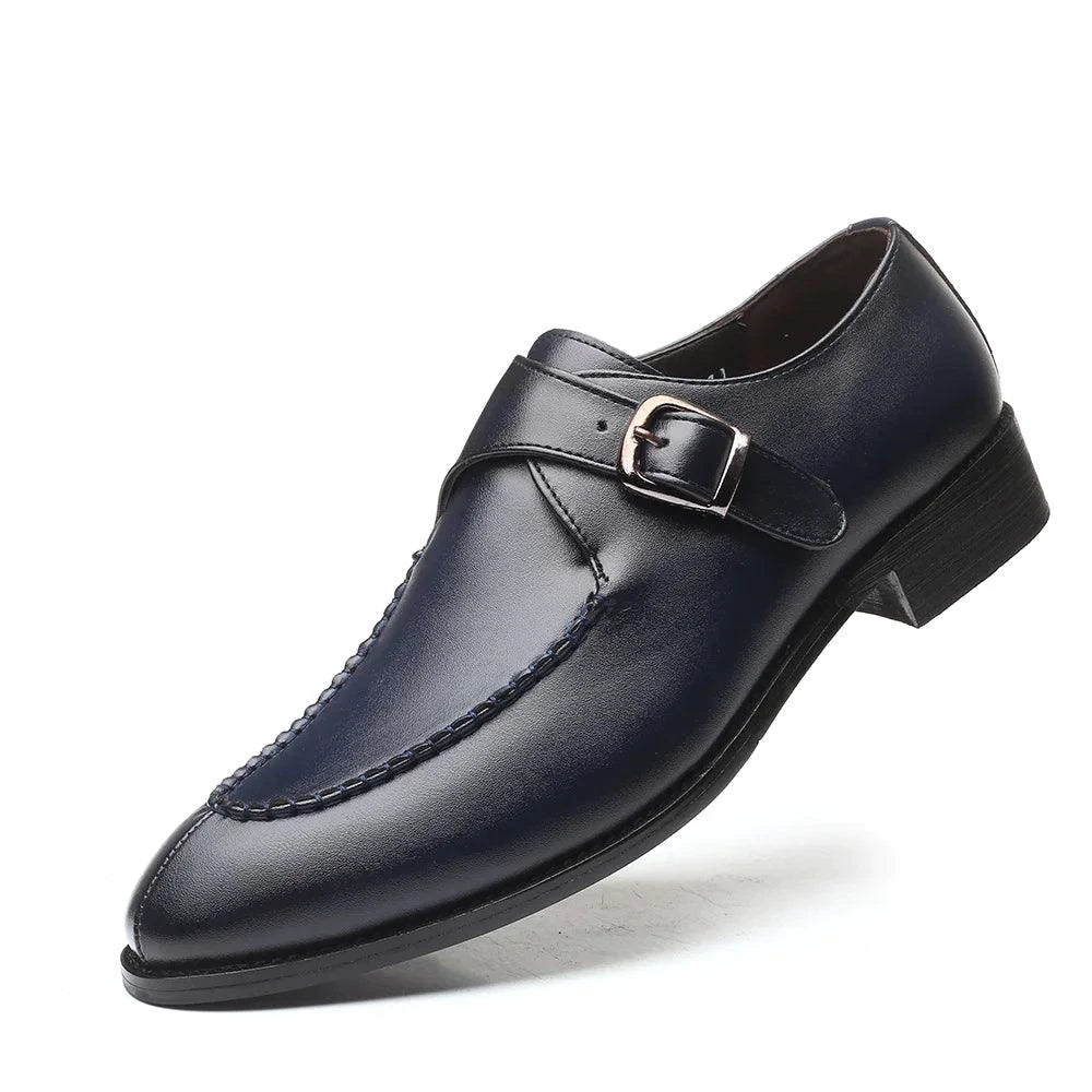 Black leather Oxford shoes by MANDOTOS featuring classic lacing and sleek design. Perfect for formal or professional wear.