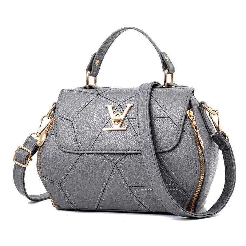 Elegant leather tote bag by MANDOTOS featuring sleek design, sturdy handles, and spacious interior for everyday use.