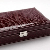 Elegant leather vanity case by MANDOTOS with a classic design, featuring a polished finish and secure clasp for travel and storage.