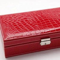 Elegant leather vanity case by MANDOTOS with a sleek design, featuring a secure clasp and spacious interior for beauty essentials.
