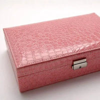Elegant leather vanity case by MANDOTOS with a sleek, stylish design and compact size for travel and organization.