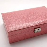 Elegant leather vanity case by MANDOTOS featuring a classic design with a sturdy handle and secure clasps.