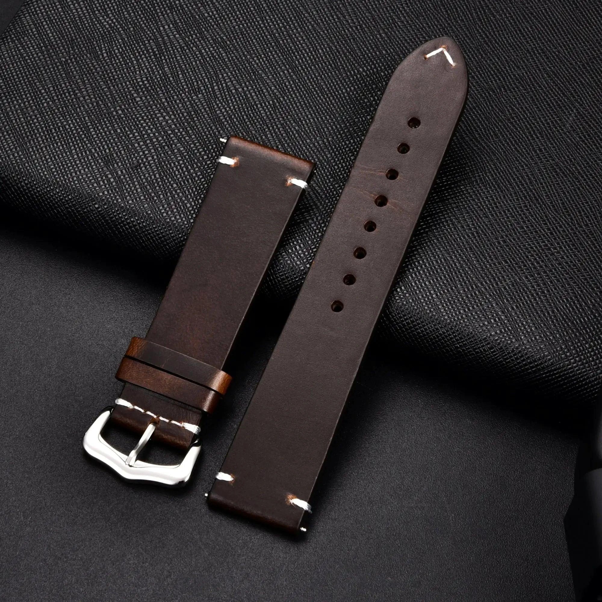 Elegant leather watch band by MANDOTOS featuring smooth dark brown leather and silver buckle closure.