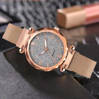 Elegant rose gold MANDOTOS timepiece with a sleek design and minimalist dial, displayed on a white background.