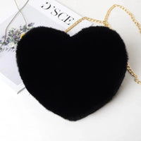 Mandotos women's heart-shaped faux fur crossbody bag with plush soft shoulder strap and chain detail, stylish shopper tote for women.