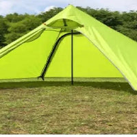 Mandotos Featherlight Pyramid Camp Shelter set up outdoors, showcasing lightweight, durable camping shelter with open sides and rain cover