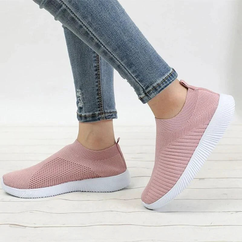 Mandotos flat knitted shoes in neutral tones, showcasing their comfortable, stylish design and textured knit upper.