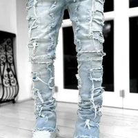 Mandotos FlexiStyle denim jeans featuring classic five-pocket design, slim fit, and medium wash fabric.