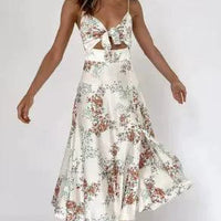 Mandotos floral boho chic midi dress with colorful floral pattern and flowing fabric, perfect for summer or casual wear.
