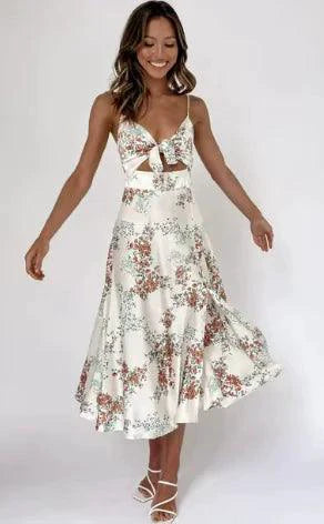 Mandotos floral boho chic midi dress with a flowing silhouette and vibrant flower print, perfect for summer bohemian style.