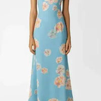 Mandotos Floral Elegance puff sleeve dress with a fitted waist and floral print, perfect for spring and summer occasions.