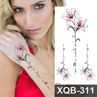 Mandotos Floral Essence Body Art Tattoo featuring intricate floral design on skin, showcasing detailed black ink artwork.