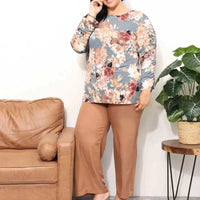 Mandotos Floral Grace boatneck blouse featuring a floral pattern, lightweight fabric, and relaxed fit, perfect for casual or dressy occasions.