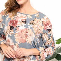 Mandotos Floral Grace boatneck blouse with a floral pattern and relaxed fit, featuring a feminine and stylish design.