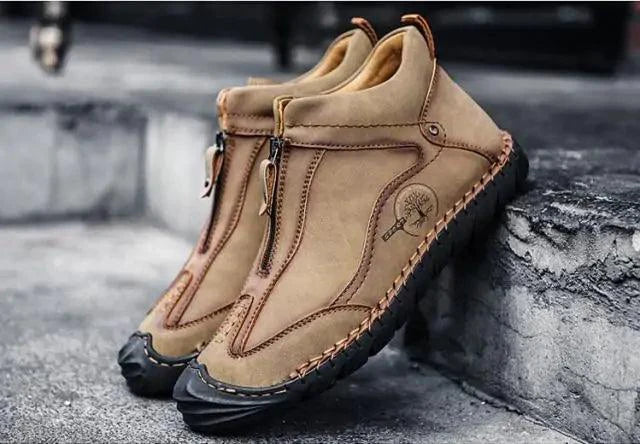 Mandotos men's leather loafers with classic slip-on design, smooth black leather, and stylish stitching detail.