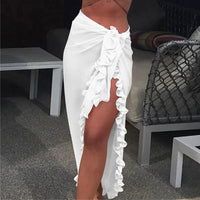 Mandotos GlamourWave chiffon beach wrap draped over a model, showcasing its lightweight, elegant design for sunny day beach wear.