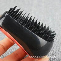 Mandotos GlamWave Luxe hair styling brush with detangling bristles, designed for smooth, shiny hair and effortless styling.
