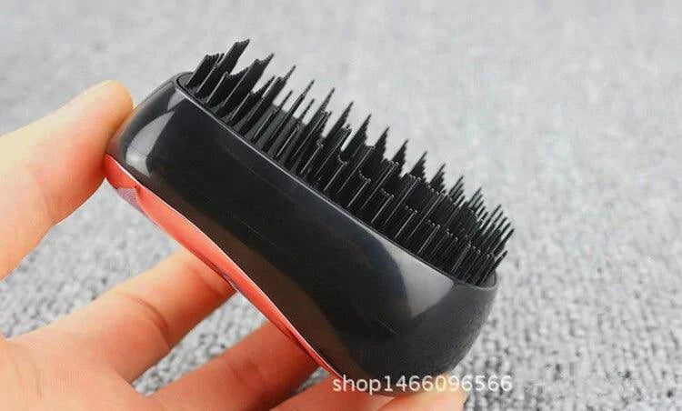 Mandotos GlamWave Luxe hair styling brush with detangling bristles, designed for smooth, shiny hair and effortless styling.
