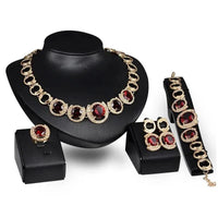 Mandotos 4-piece gold jewelry set with blue gemstones, perfect for wedding collection featuring necklace, earrings, bracelet, and ring