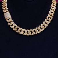 Gold Shine Iced Cuban Chain by MANDOTOS featuring a luxurious iced design and bold Cuban link style.