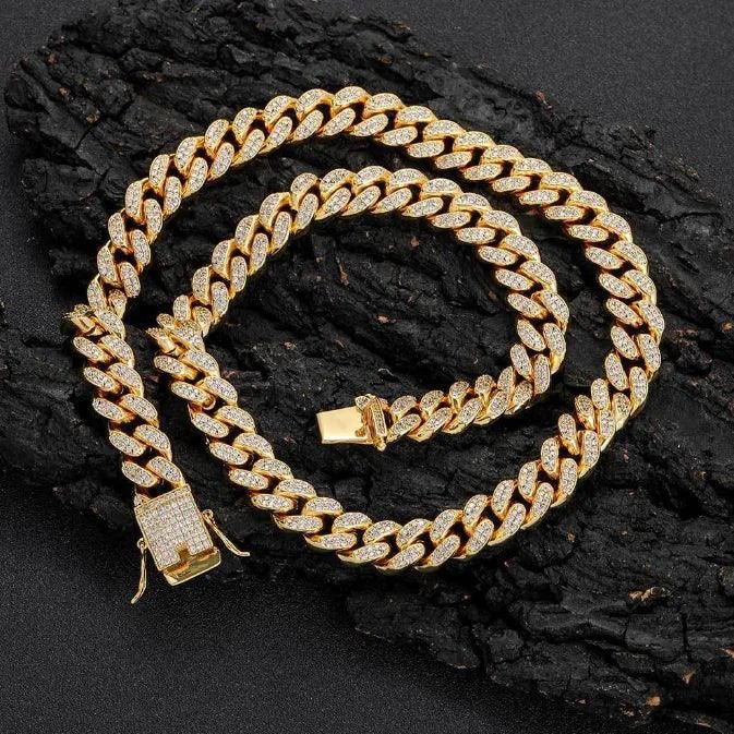 Mandotos Gold Shine Iced Cuban Chain featuring a luxe style upgrade with sparkling iced detailing and bold Cuban link design.