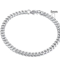 Gold-tone stainless steel Cuban bracelet with 3-11mm links, crafted by MANDOTOS, showcasing a sleek and polished design.