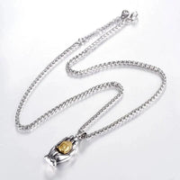 Golden Buddha pendant from MANDOTOS featuring intricate design and polished gold finish, hanging on a delicate chain.
