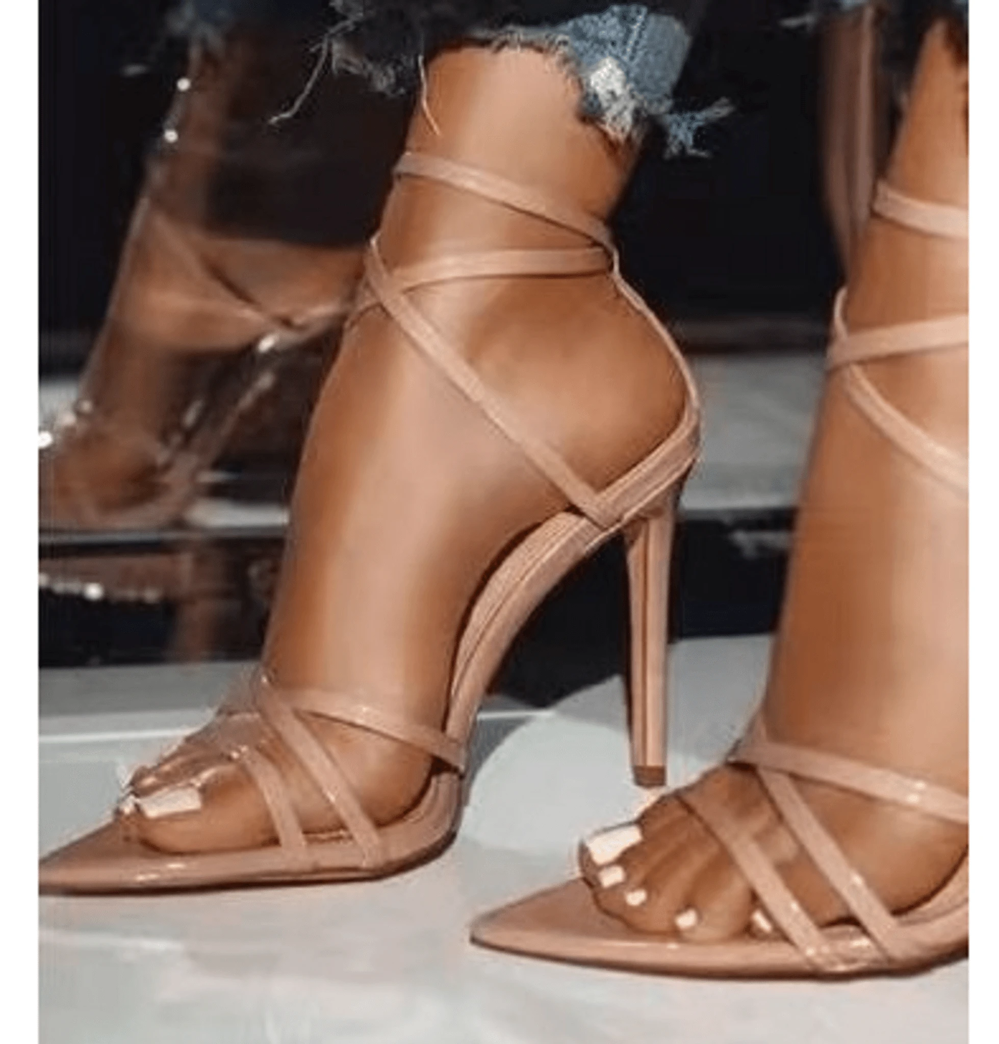 Golden strappy stiletto pumps by MANDOTOS with sleek design and high heels, perfect for stylish evening wear.
