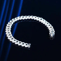 18k gold Cuban link bracelet by MANDOTOS, showcasing a shiny, sturdy gold chain with a secure clasp.