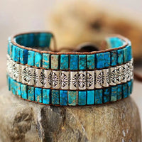 Handmade triple-layer natural stone bracelet by MANDOTOS featuring smooth, polished stones on a durable elastic cord.