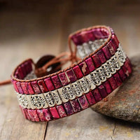 Handmade triple-layer natural stone bracelet by MANDOTOS with smooth beads and stylish design, perfect for casual or elegant wear.