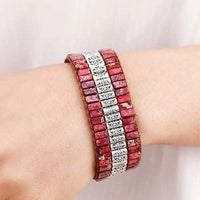 Handmade triple-layer natural stone bracelet from MANDOTOS featuring polished stones and adjustable cord design.