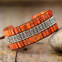 Handmade triple-layer natural stone bracelet by MANDOTOS featuring polished stones and adjustable cord closure.