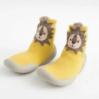 Mandotos Happy Feet toddler shoes in soft fabric with Velcro straps, designed for comfort and easy wear for young children.