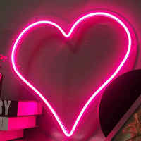 Mandotos Heart Glow LED Neon Light glowing with vibrant pink and white colors, perfect for room decor or ambiance lighting.