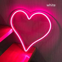 Mandotos Heart Glow LED neon light illuminated in vibrant pink, perfect for wall decor or ambient lighting.