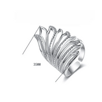 Mandotos Heavenly Diamond Wing Ring featuring sparkling diamond accents and intricate wing design on silver band.