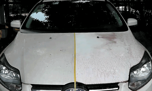 Mandotos HGKJ car paint and wheel iron particles remover spray cleaning auto rims and metal surfaces of rust and dust.