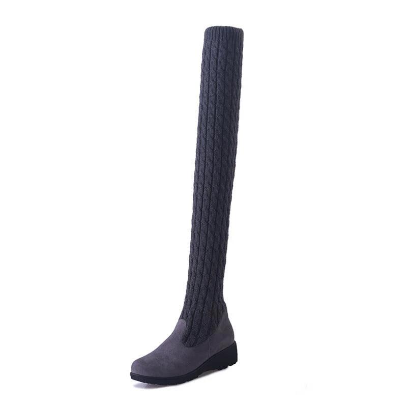 Mandotos high flat over-the-knee stretch Martin boots showcasing sleek black leather and knee-high design.